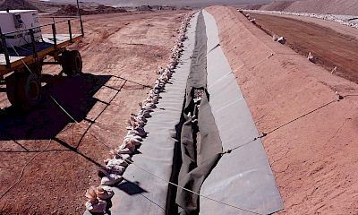 Geomembrane installation: Leach pad perimeter channel