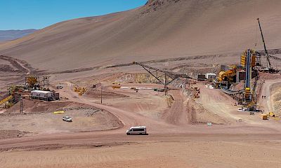 Panoramic view of secondary crusher, stockpile and tertiary crusher