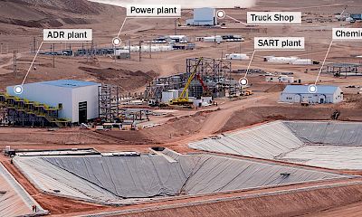 Panoramic view of leach pad solution ponds, ADR and SART plants, power plant, truck shop, and chemical lab