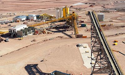 Panoramic view of stockpile, tertiary crusher, agglomeration plant and leach pad