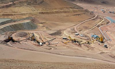 Panoramic view of coarse ore stockpile, crushing circuit, and agglomeration plant